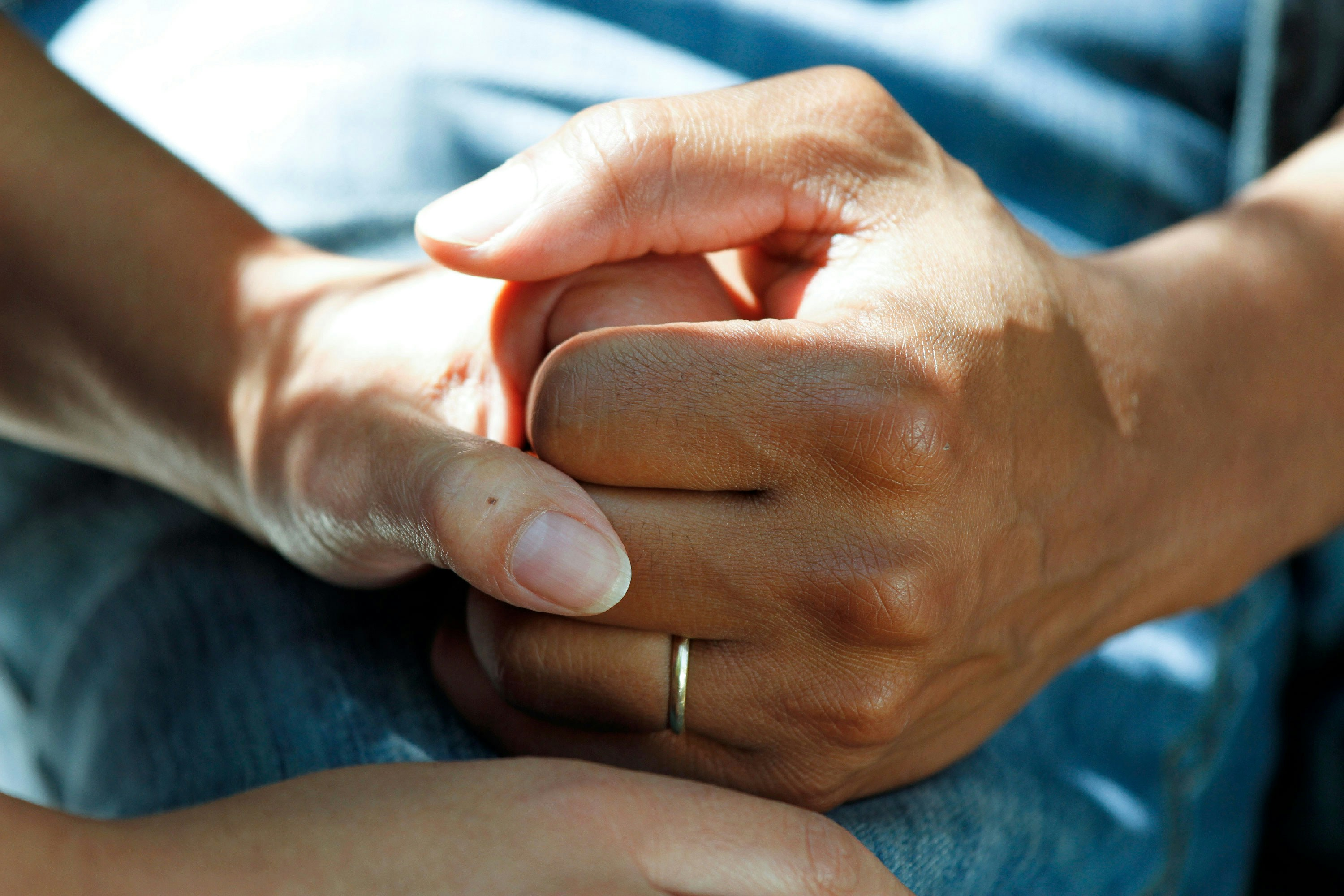 carer holding hands with patient