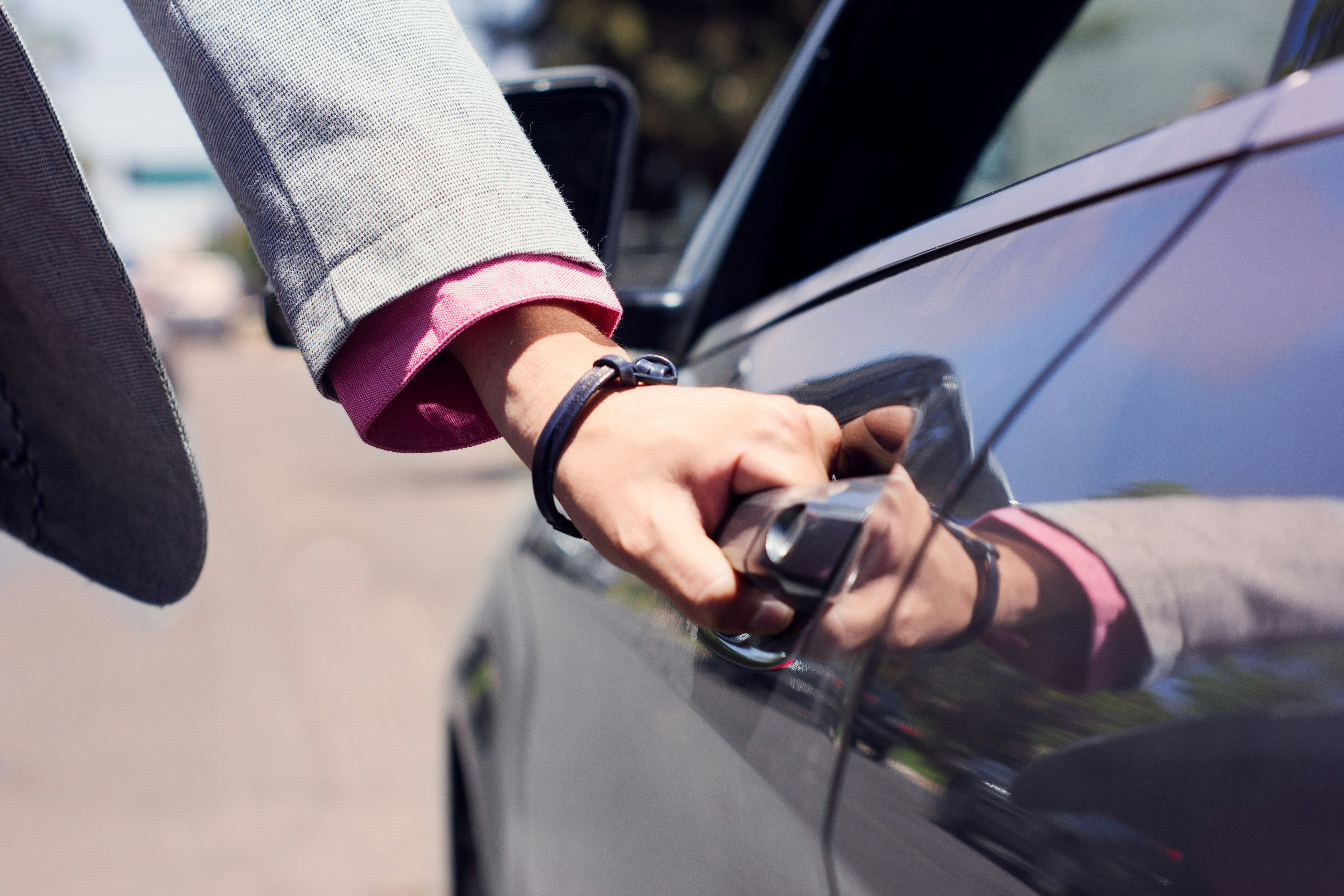 man opening car door
