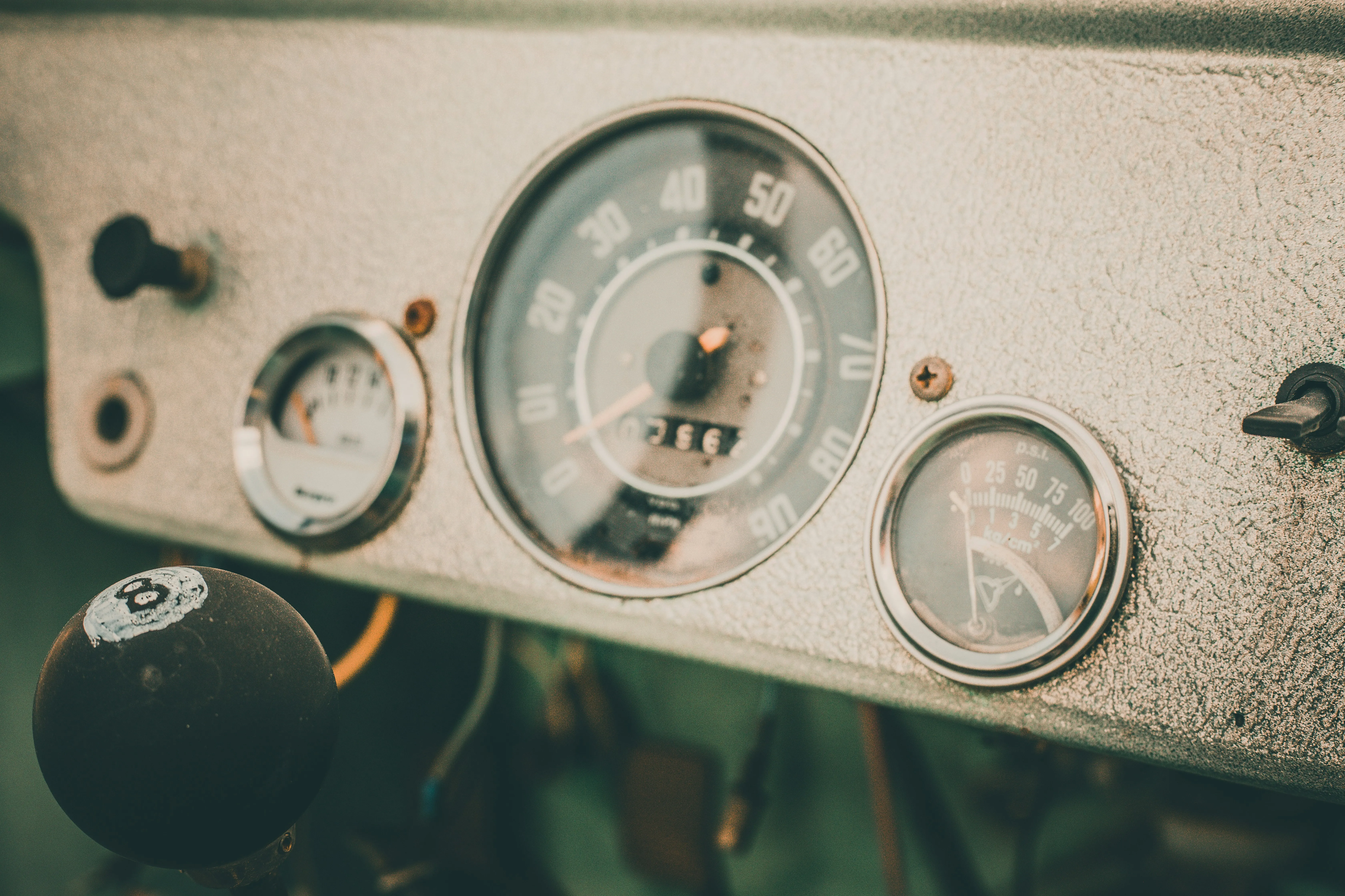 An odometer and a speedometer on a vintage vehicle